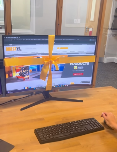 A computer screen with a yellow bow on it to celebrate our new website
